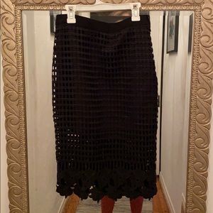 Cute black pencil skirt with lace detail.